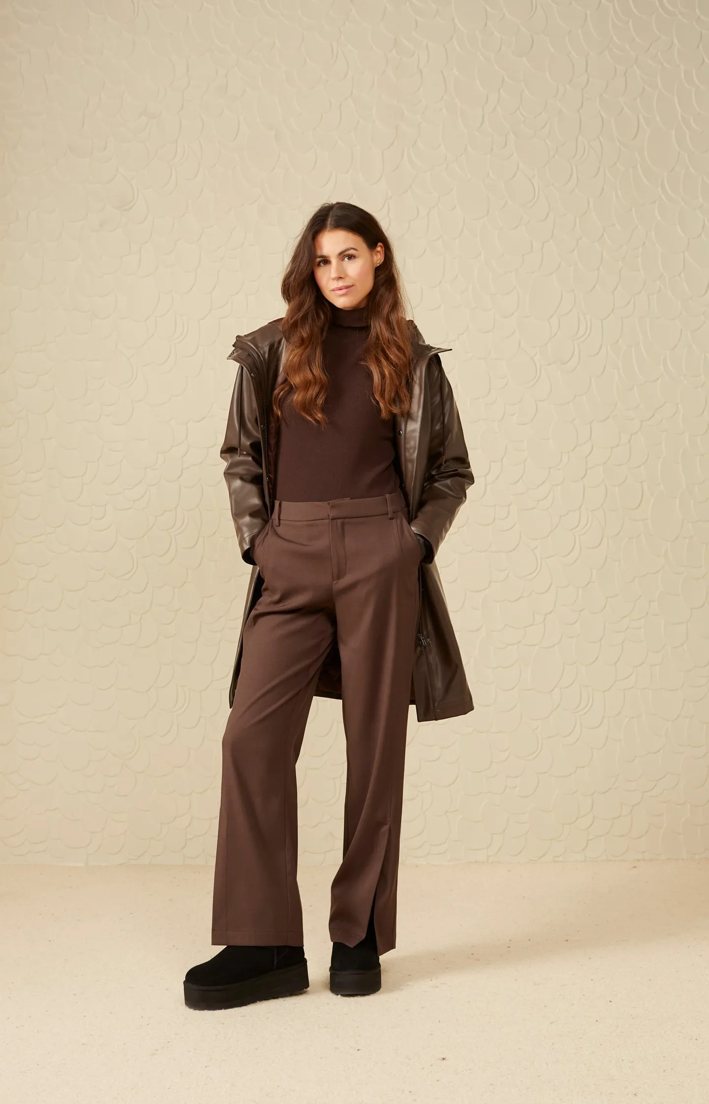 Parka jacket with a hood, pockets, buttons and a zip